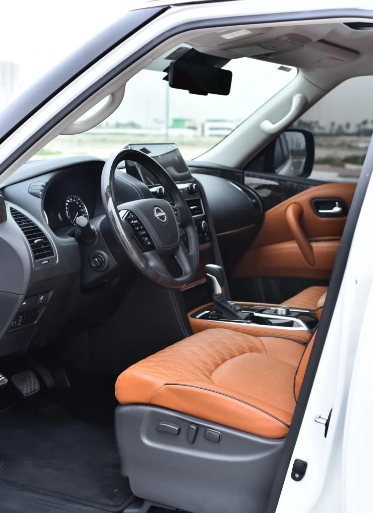 Side profile of Nissan Patrol Platinum 2024 luxury SUV in Dubai